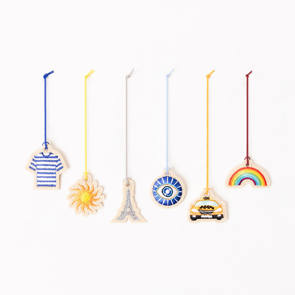 Ensemble des charms brodés Marinière, Soleil, Tour Eiffel, Oeil grec, Taxi et Arc-en-ciel – par Venitee Family