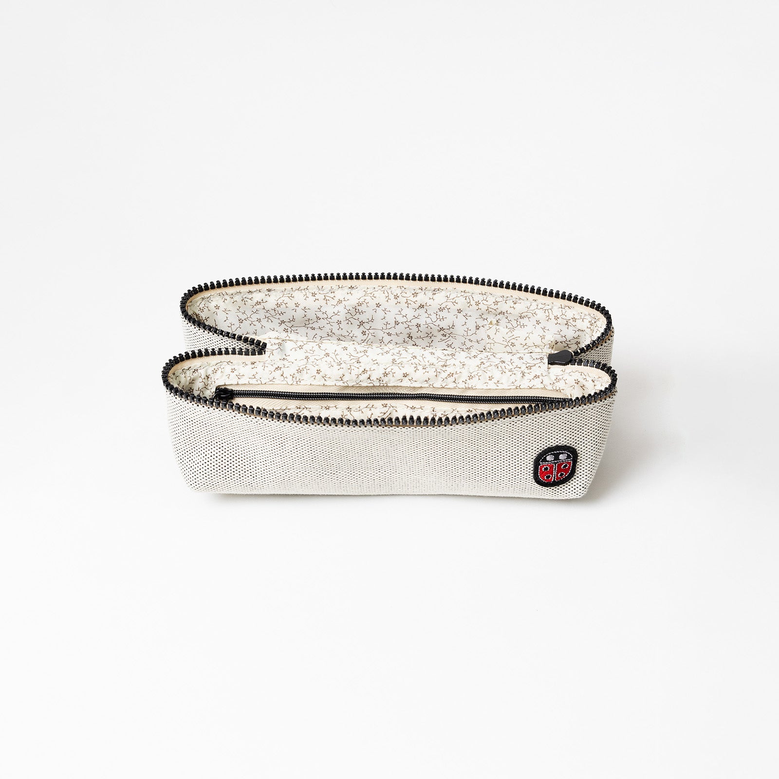 Intérieur de la trousse de toilette TWIN Faubourg Small – par Venitee Family